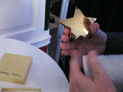 Hand holding an award.