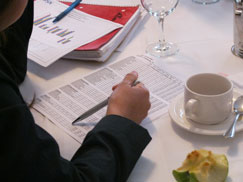 Reviewing paperwork at a meeting.