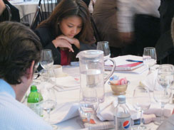 Female member participating in a meeting.